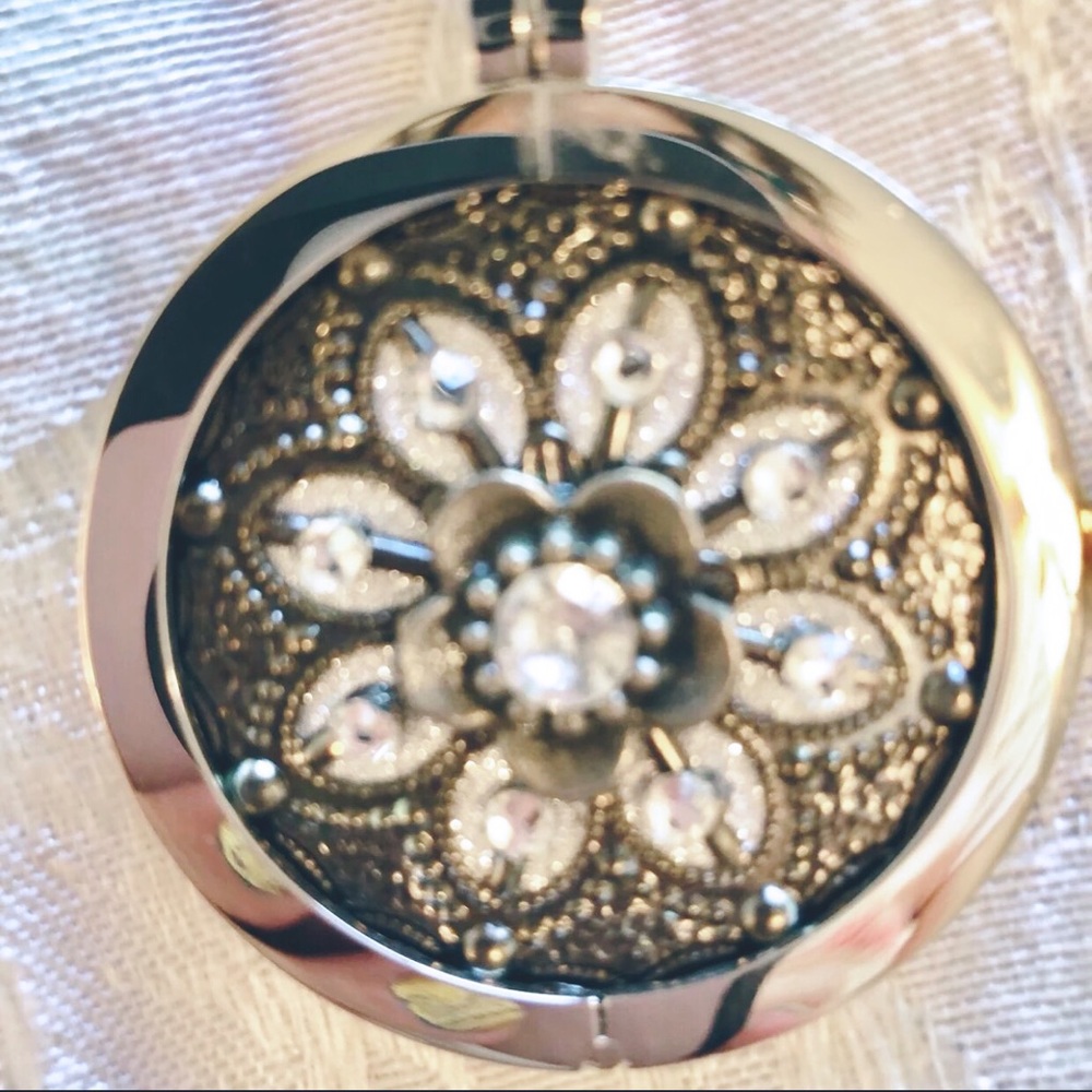 Silver tone crystal flower pendant